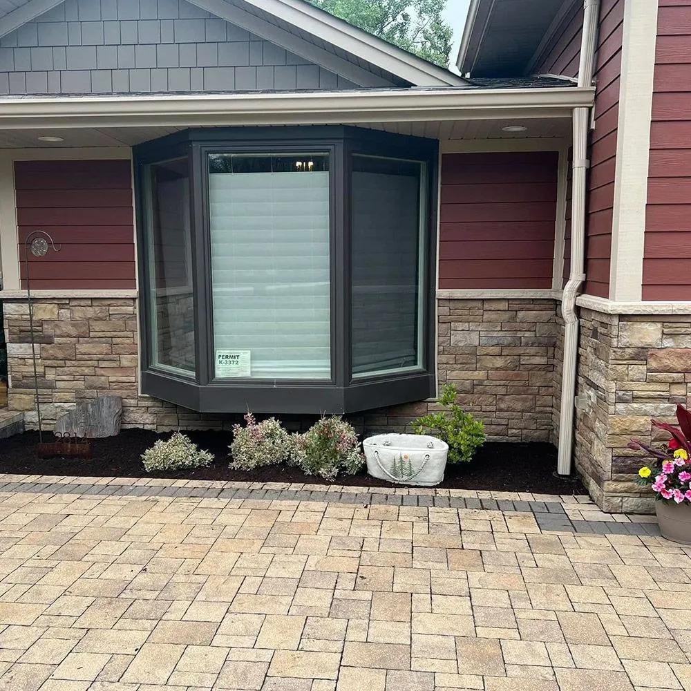 Stone patio and retaining wall installation