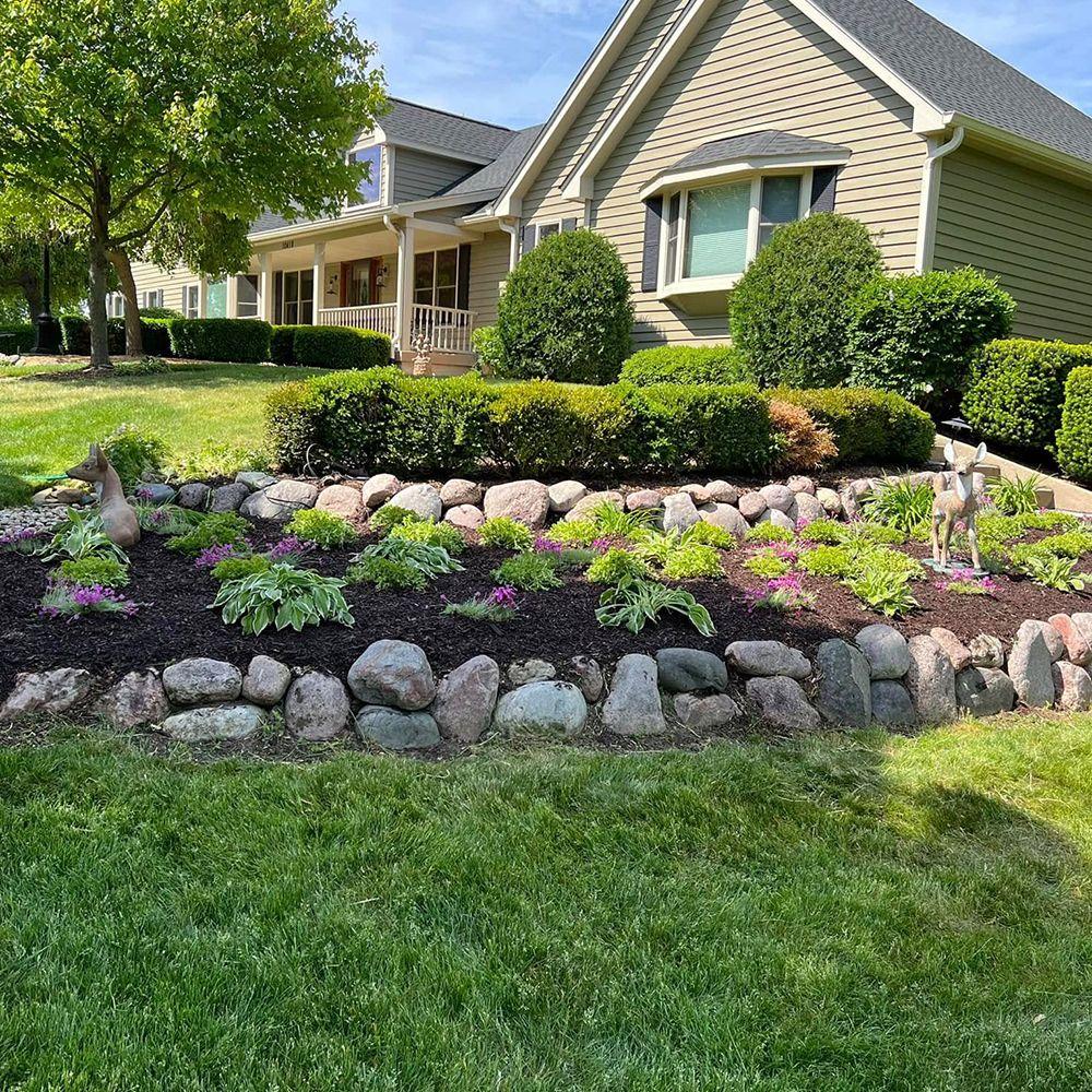 Stone retaining wall and landscape design